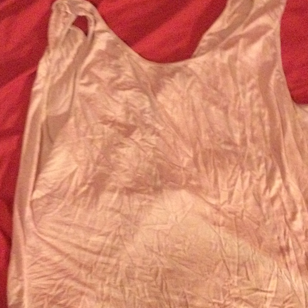 A cute light pink and grey shirt with an open back